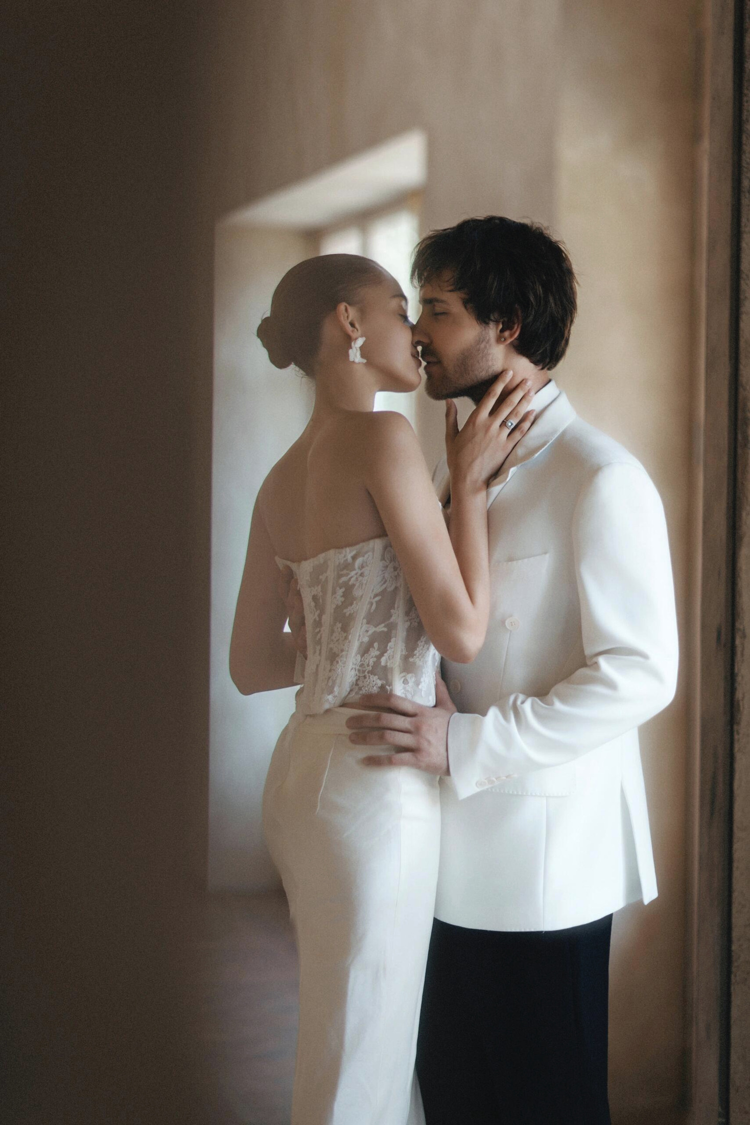 A newly married couple sharing a quiet moment indoors