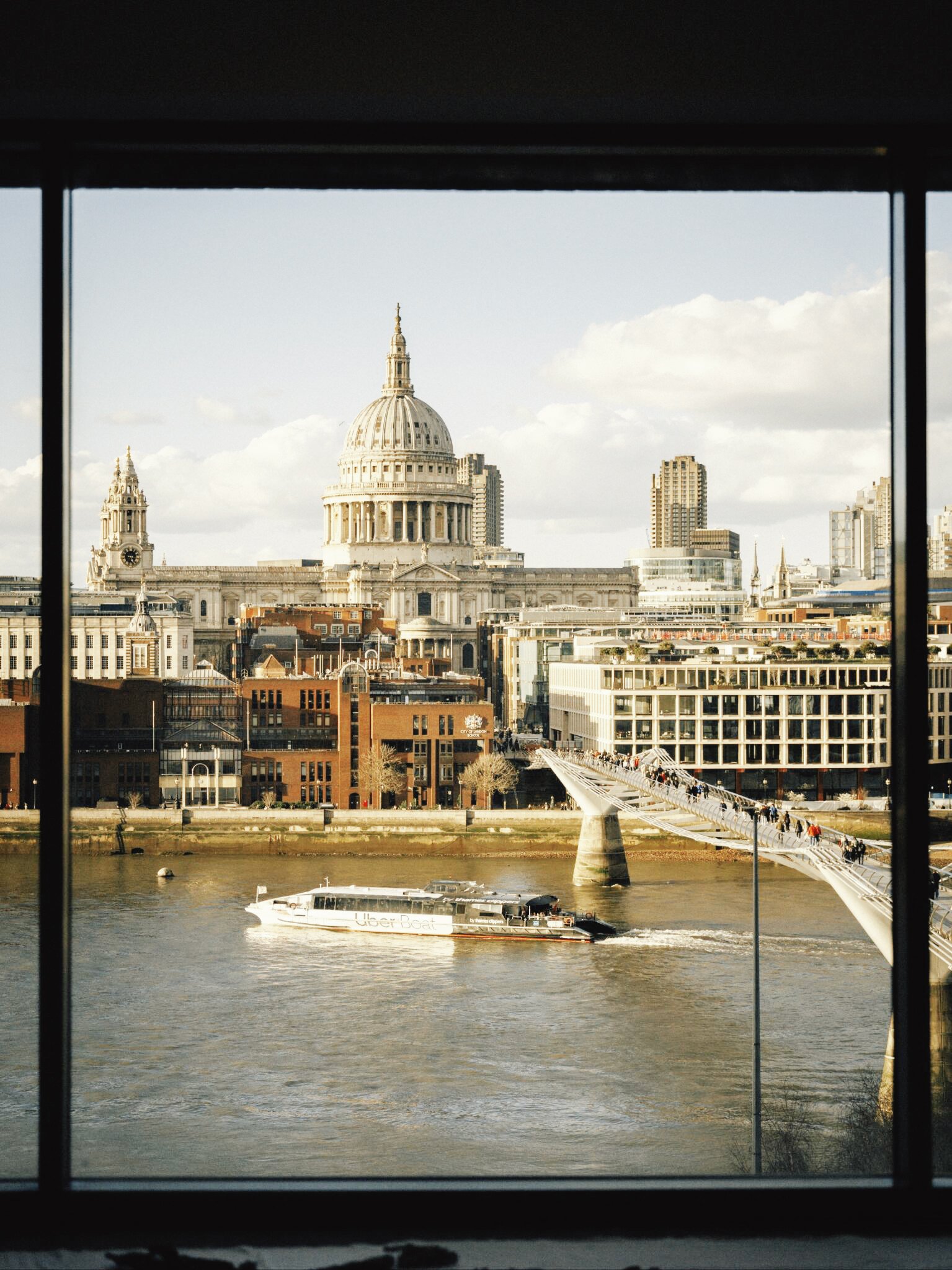 St Paul's Cathedral and the Millennium Bridge seen through a window